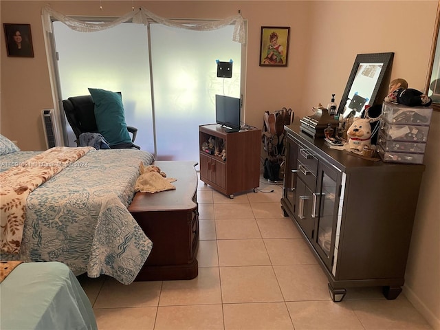 bedroom featuring light tile floors