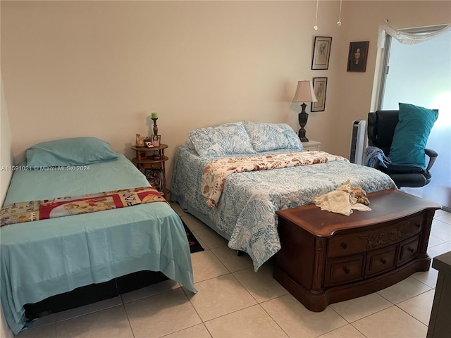 bedroom with light tile flooring