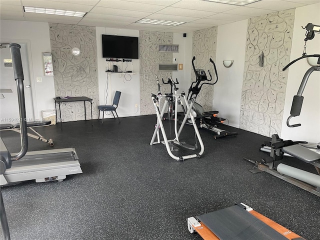 exercise room featuring a drop ceiling