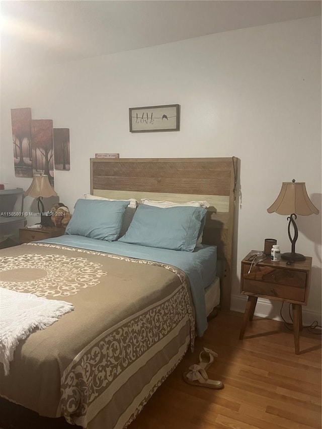 bedroom featuring wood-type flooring