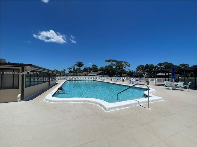 view of swimming pool with a patio