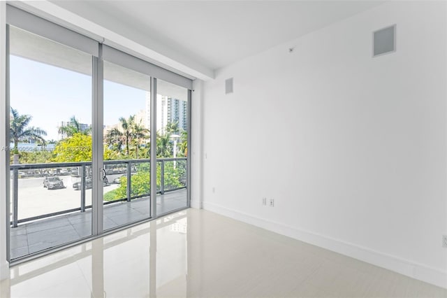 tiled spare room with baseboards