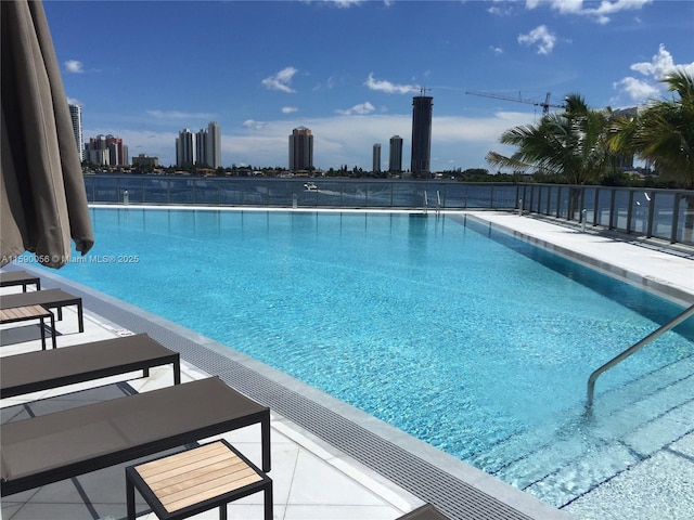 community pool featuring a view of city
