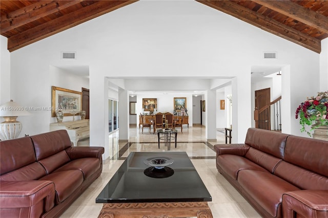 living room with lofted ceiling with beams and wooden ceiling