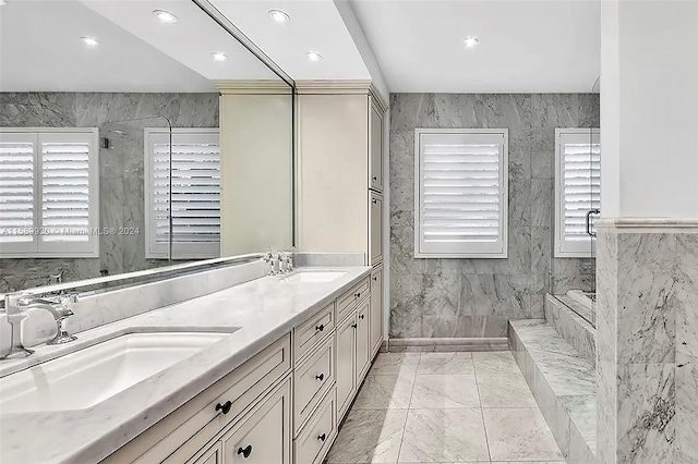 bathroom featuring vanity, a shower, and tile walls