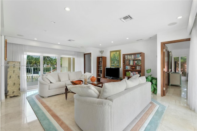 tiled living room with a wealth of natural light