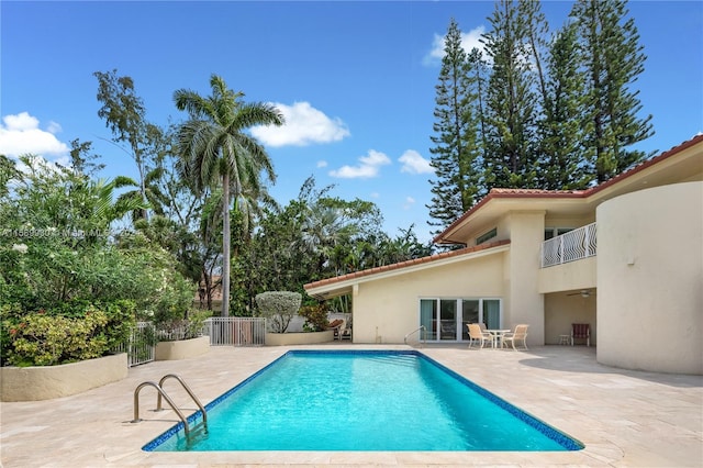 view of swimming pool featuring a patio area