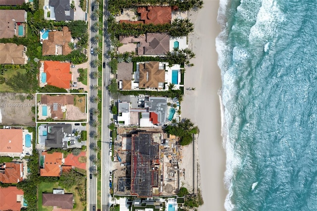 aerial view featuring a water view and a beach view