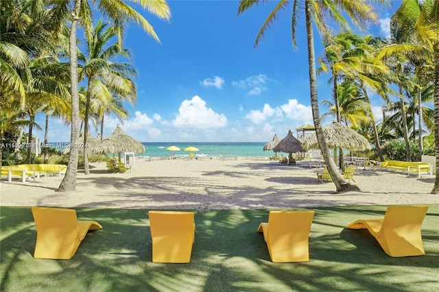 view of community featuring a water view, a view of the beach, and a gazebo