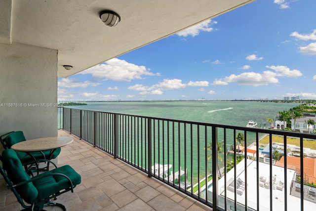 balcony featuring a water view