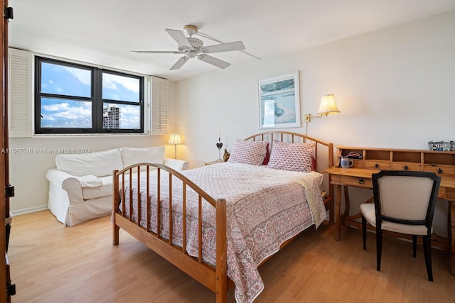 bedroom featuring light wood-type flooring and ceiling fan