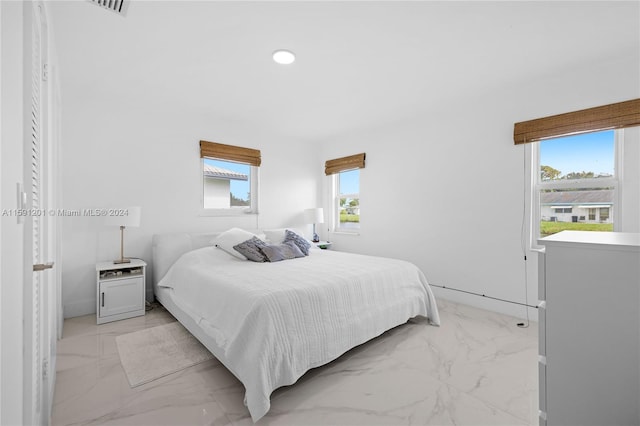 bedroom with light tile patterned flooring