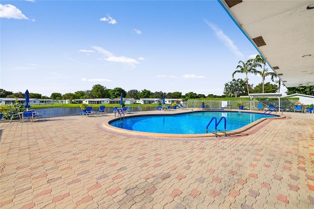 view of swimming pool with a patio