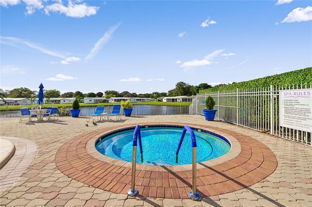 view of swimming pool featuring a patio area