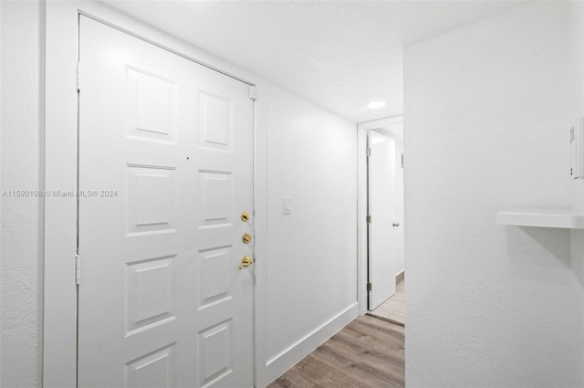 hallway featuring light hardwood / wood-style flooring