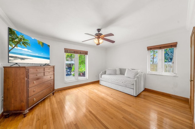 bedroom featuring ornamental molding and light hardwood / wood-style floors