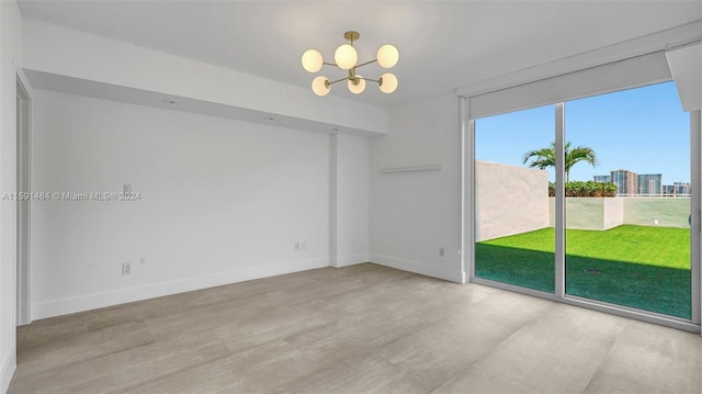 empty room with an inviting chandelier