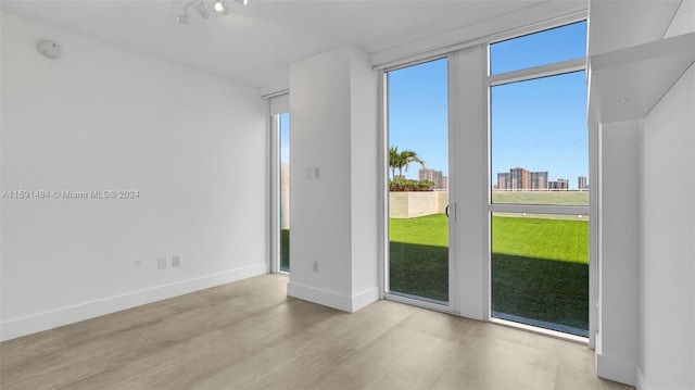 unfurnished room featuring light hardwood / wood-style floors