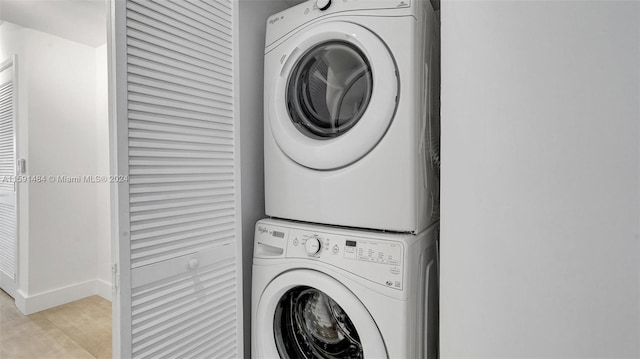 laundry room featuring stacked washer and clothes dryer