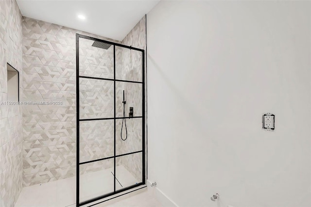 bathroom with tiled shower