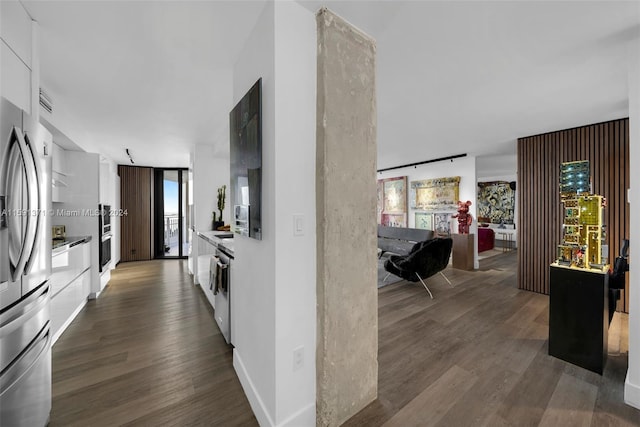 corridor featuring dark hardwood / wood-style floors