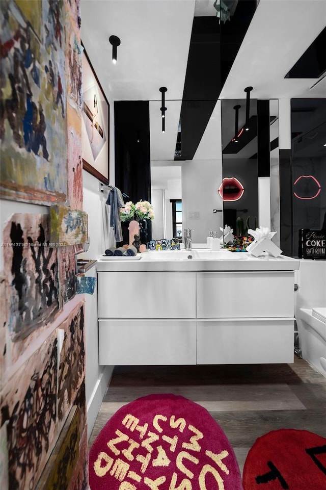 interior space with hardwood / wood-style flooring and vanity