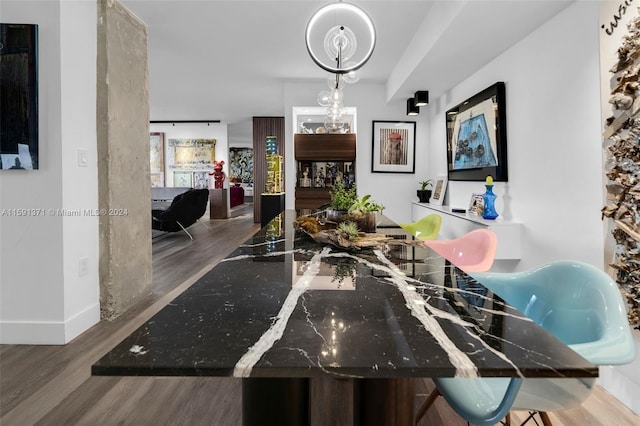 dining area with hardwood / wood-style floors