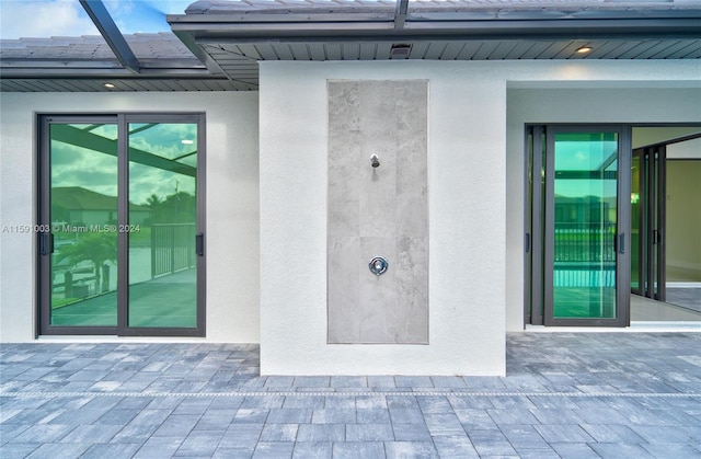 property entrance with a patio