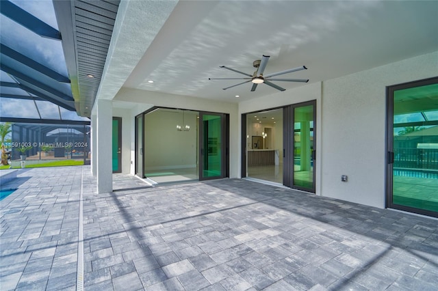 view of patio / terrace with ceiling fan and a lanai