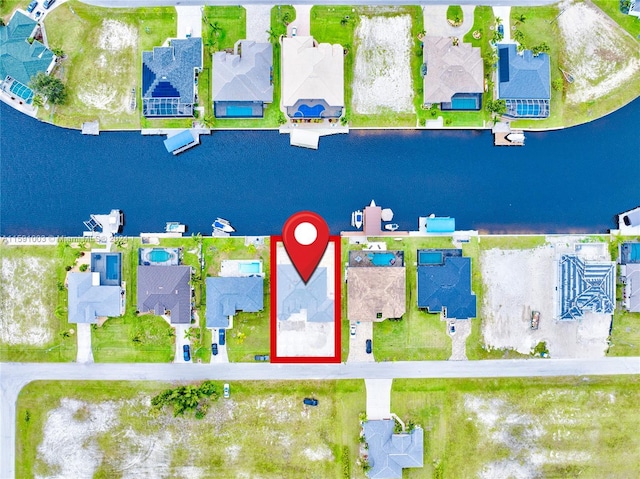 birds eye view of property featuring a water view