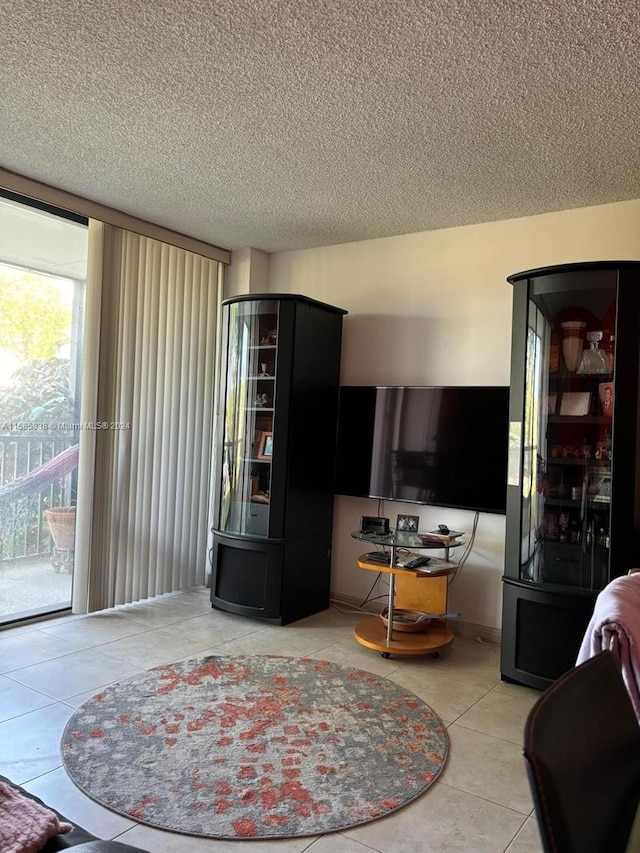 tiled living room with a textured ceiling