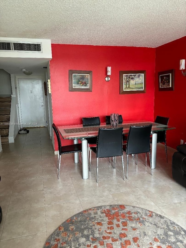 dining room featuring a textured ceiling