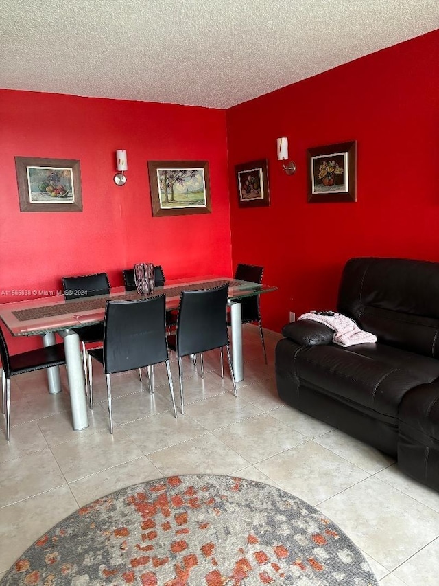 dining area featuring a textured ceiling