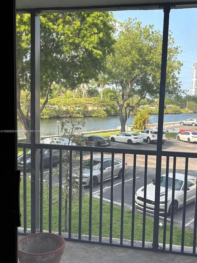 balcony featuring a water view