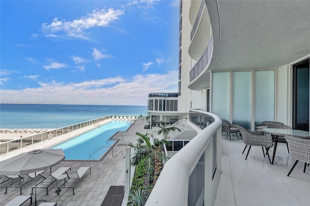 balcony featuring a water view