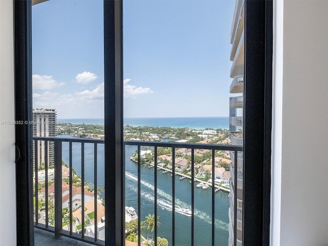 balcony featuring a water view