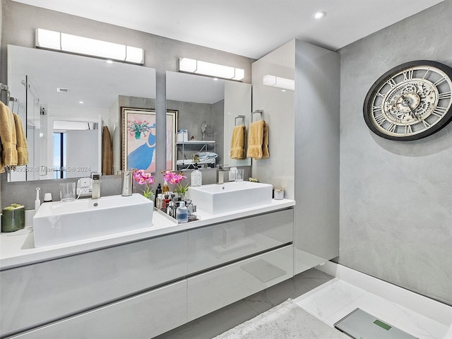 bathroom with tile flooring and dual vanity