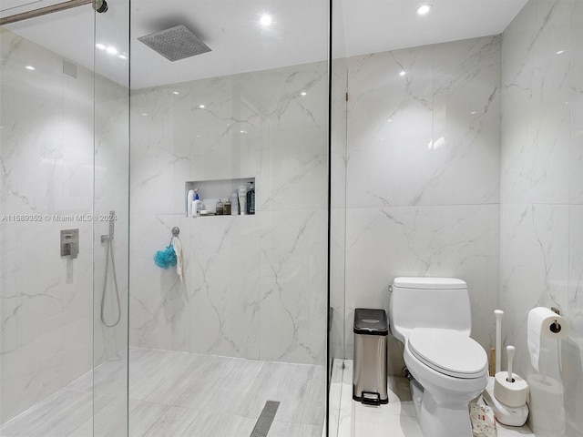 bathroom featuring walk in shower, tile walls, toilet, and tile floors