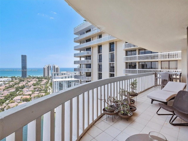 balcony featuring a water view