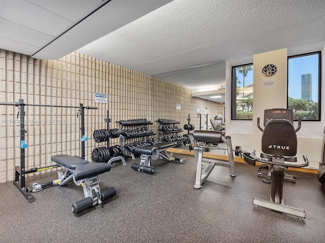 workout area featuring a textured ceiling