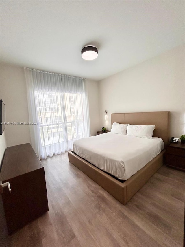 bedroom featuring hardwood / wood-style flooring