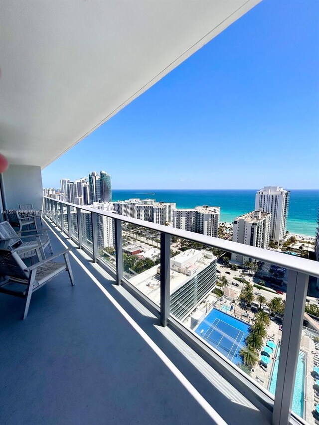 balcony featuring a water view