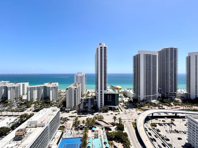 drone / aerial view with a view of city and a water view