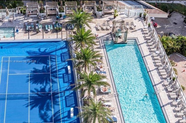 pool featuring a tennis court