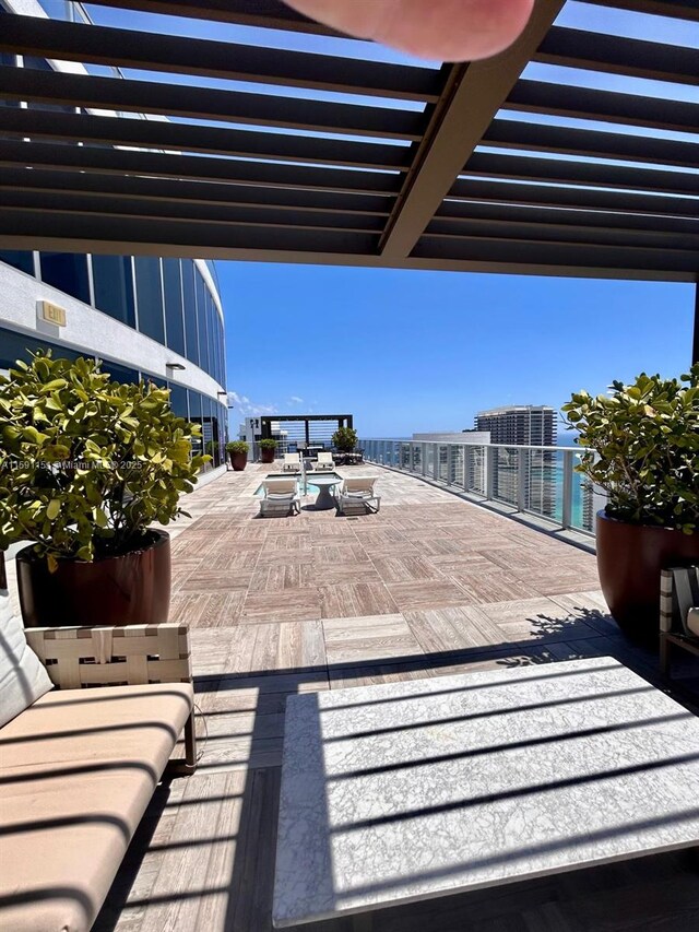 view of terrace with a pergola