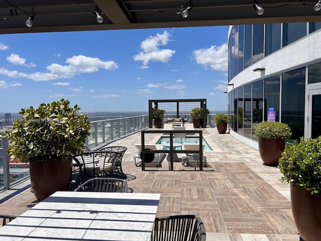 view of patio with a water view