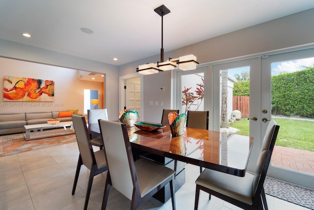 dining area with french doors and light tile patterned flooring