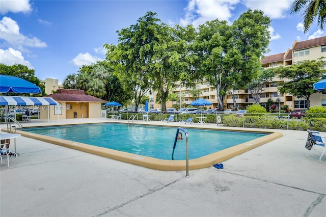 view of swimming pool with a patio