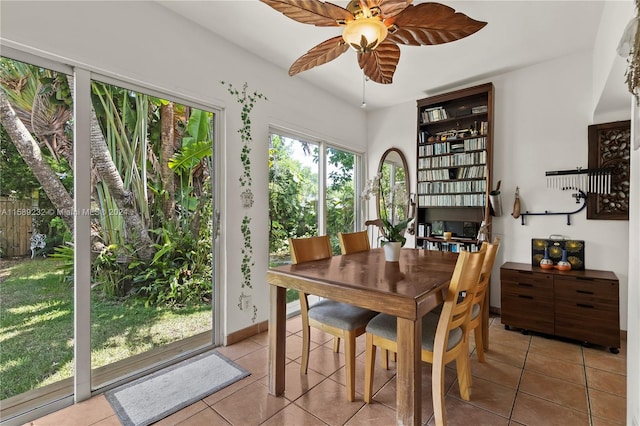 dining room featuring tile floors and ceiling fan