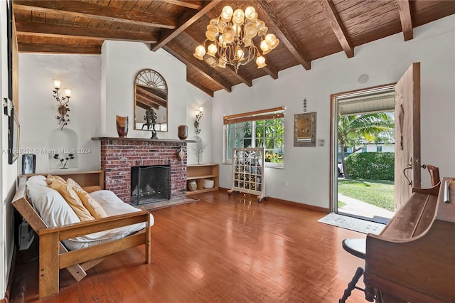 living room with wood-type flooring, beamed ceiling, wood ceiling, and a fireplace